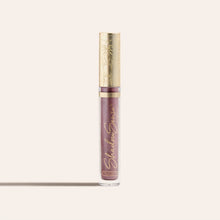 Load image into Gallery viewer, ShadowSense Eyeshadow NZL in a tall clear tube with purple glittery formula and an ornate gold cap
